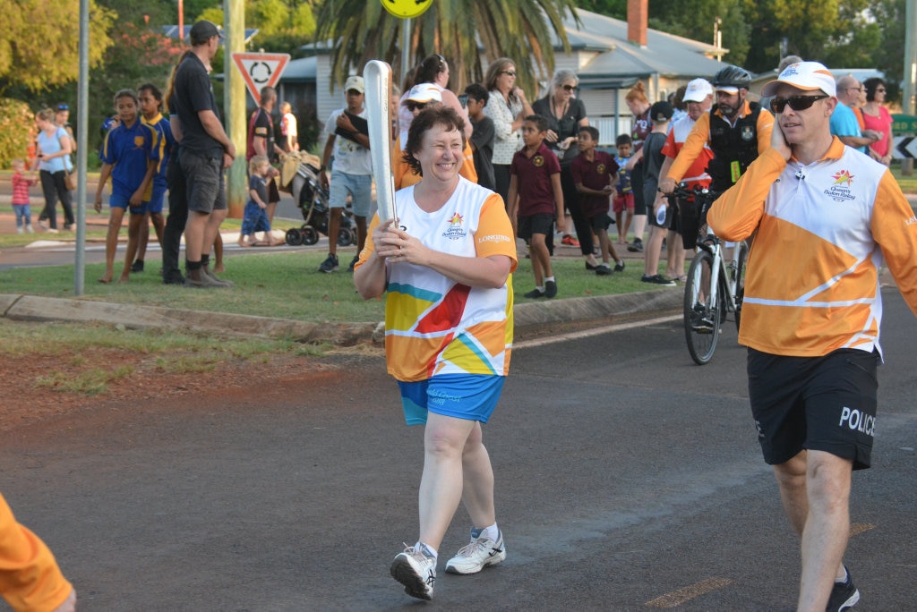 Rowena Dionysius running with the baton to Memorial Park, Kingaroy, for the Commonwealth Games Queen's Baton Relay 2018. Picture: Christian Berechree