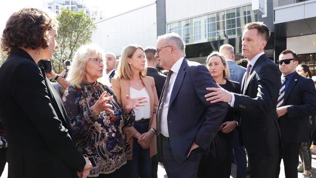 Politicians paying their respects. Wentworth MP Allegra Spender, Waverley mayor Paula Masselos, Vaucluse MP Kellie Sloane, Prime Minister Anthony Albanese, Coogee MP Majorie O’Neill and NSW premier Chris Minns at Westfield Bondi Junction shopping centre. Photo: Jane Dempster