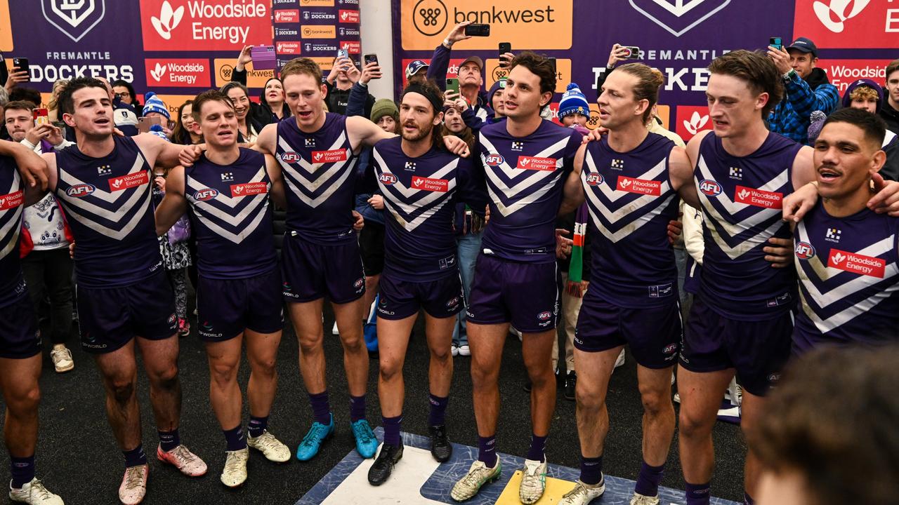 PERTH, AUSTRALIA - JULY 06: The Dockers sing the team song during the 2024 AFL Round 17 match between the Fremantle Dockers and the Richmond Tigers at Optus Stadium on July 06, 2024 in Perth, Australia. (Photo by Daniel Carson/AFL Photos via Getty Images)