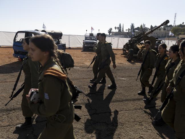 NORTHERN ISRAEL, ISRAEL - DECEMBER 23: Israeli soldiers walk at an IDF display of weaponry reportedly uncovered during its operation in Lebanon in an army base on December 23, 2024 in Northern Israel, Israel. Israel began carrying out ground operations in Lebanon on October 1, after nearly a year of cross-border hostilities in the aftermath of the October 7 Hamas attacks in Israel. A ceasefire agreement between Israel and Hezbollah has largely held since November 27, despite some cross-border exchanges of violence over the past few weeks. (Photo by Amir Levy/Getty Images)