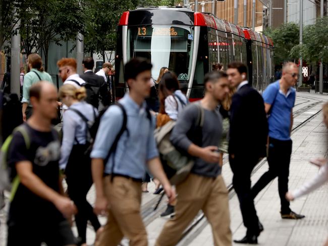 SYDNEY, AUSTRALIA - NewsWire Photos DECEMBER 14, 2020: Commuters out just before 9am on George Street near Wynyard station, Sydney CBD is slowly getting busier after the easing of Covid restrictions bringing workers back to the CBD.Picture: NCA NewsWire / Damian Shaw