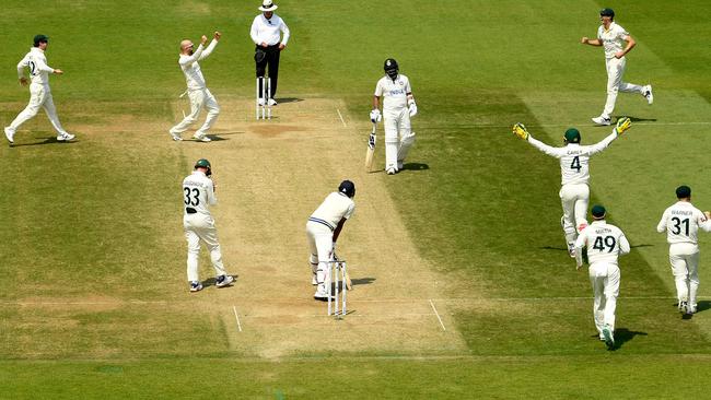 Nathan Lyon celebrates the dismissal of India's Mohammed Siraj to seal victory. Picture: AFP