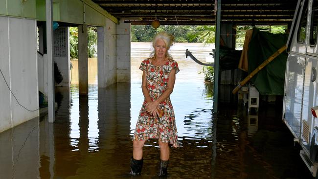 Wednesday February 13. Heavy rain causes flooding in North Queensland. Clean up after flooding in Ingham. Cordelia resident Camille O'Sullivan stands under her house with her backyard next to the Herbert River. Picture: Evan Morgan