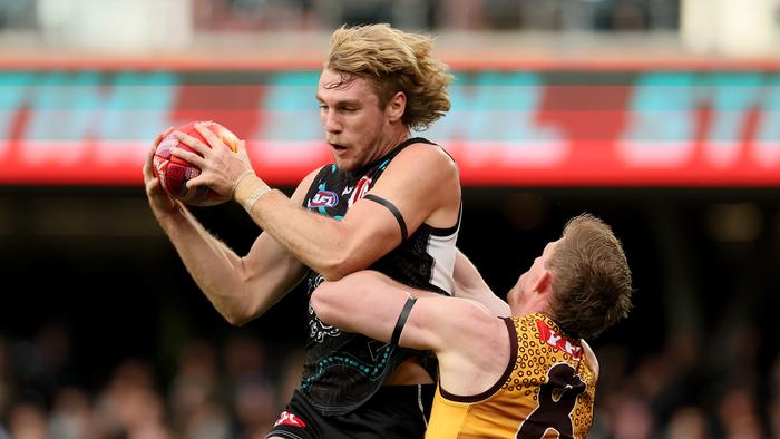 ADELAIDE, AUSTRALIA - MAY 19: Jason Horne-Francis of the Power marks over Sam Frost of the Hawks during the 2024 AFL Round 10 match between Yartapuulti (Port Adelaide Power) and the Hawthorn Hawks at Adelaide Oval on May 19, 2024 in Adelaide, Australia. (Photo by James Elsby/AFL Photos via Getty Images)