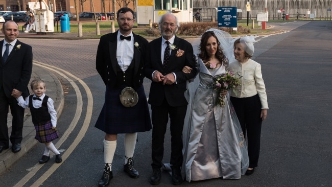 Stella Moris (2nd R) poses for pictures with Julian Assange's father John Shipton (2nd L) and brother Gabriel Shipton (L) after her wedding. Picture: Wiktor Szymanowicz/Anadolu Agency via Getty Images