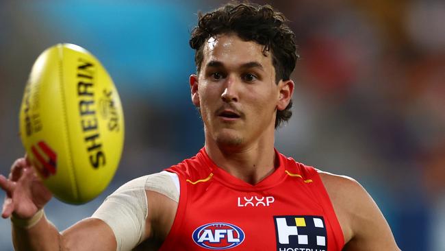 GOLD COAST, AUSTRALIA - APRIL 13: Wil Powell of the Suns warms up during the round five AFL match between Gold Coast Suns and Hawthorn Hawks at People First Stadium, on April 13, 2024, in Gold Coast, Australia. (Photo by Chris Hyde/Getty Images)