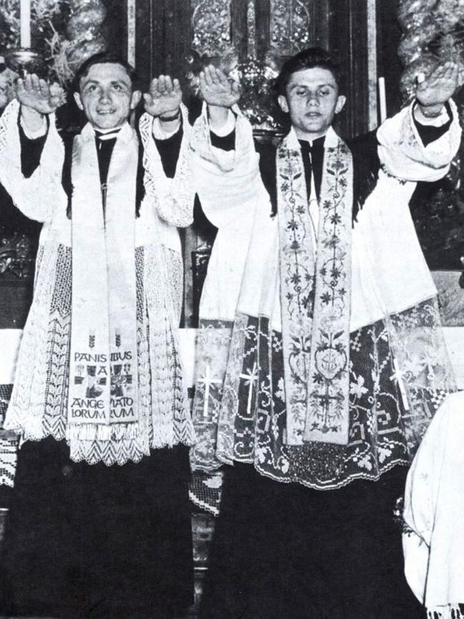 In 1951 (right) during his ordination with brother Georg. Picture: AFP