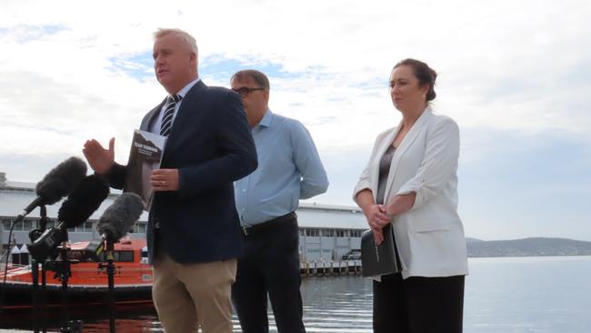 Premier Jeremy Rockliff, TCCI Chair Wayne Davy and TICT CEO Amy Hills speak to the media on the waterfront in Hobart on Monday, March 3, 2025.