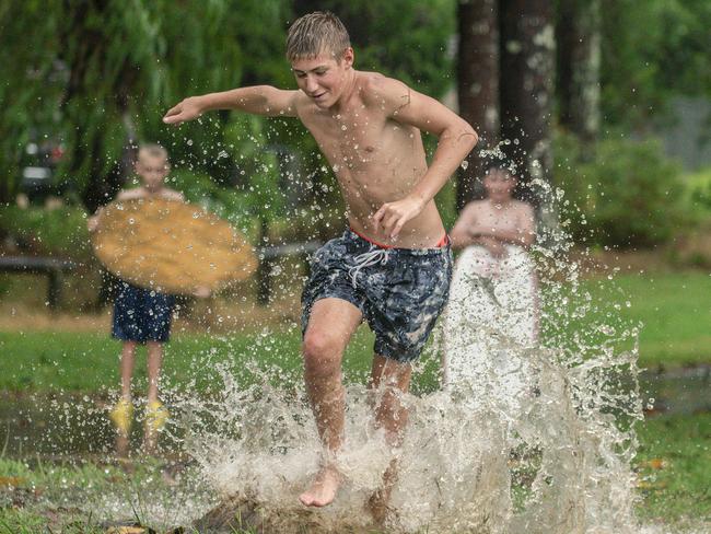 Tanner Muir and his mates take advantage of a break in the weather as the city prepares for the expected deluge from Cyclone Alfred. Picture: NewsWire/Glenn Campbell