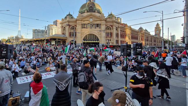 Protesters block off Flinders Street on Thursday night. Picture: Chris Woods/ Twitter @tophermwoods