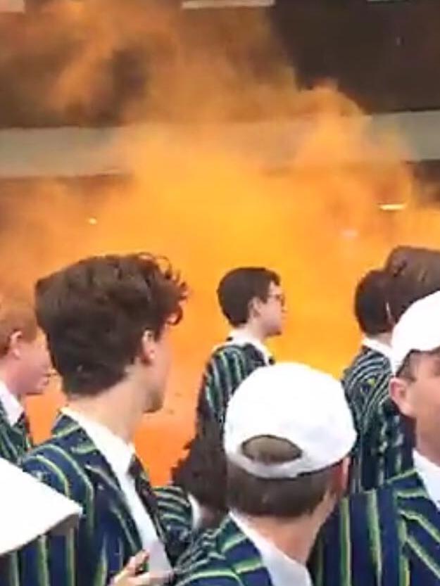 St Kevin's students set off flares at an APS athletics carnival. Picture: Supplied