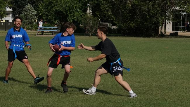 Darwin Middle School students playing Flag Football against United States Marines at DMS, 19 May 2025. Picture: Jason McIntosh