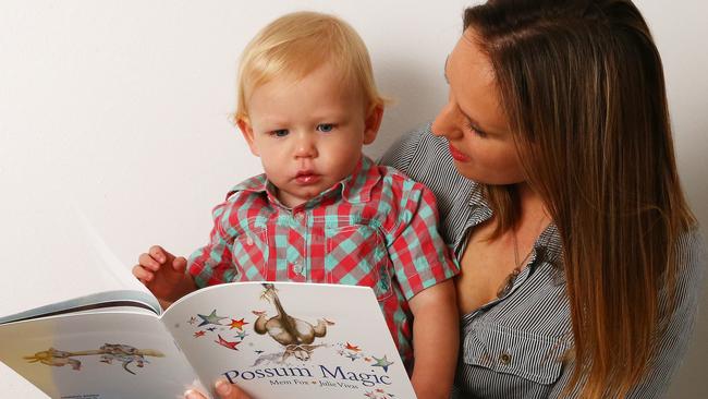 Annika Smith, 31, reads classics from The Great Australian Storybook Collection with son Theo Smith, 1. Picture: Liam Kidston