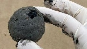 The tar balls are not rock hard, and their round shape indicates they have been at sea for at least weeks or months. Picture: Randwick City Council