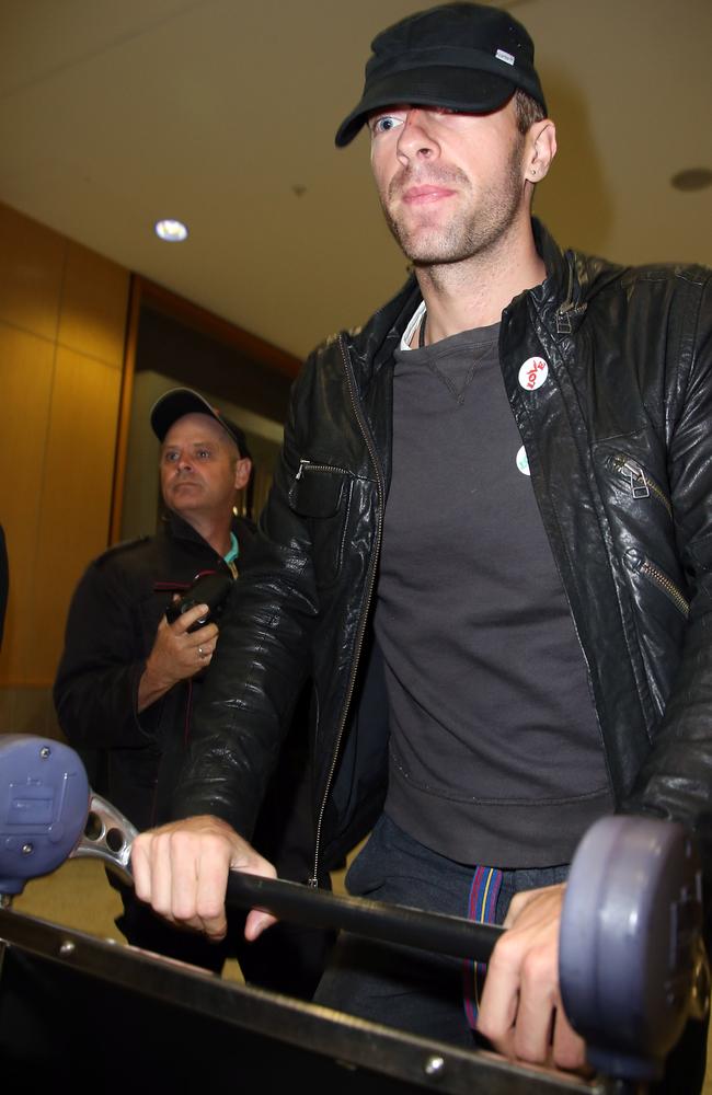 Chris’s cut... Martin walking through Sydney International Airport with blood on his nose. Picture: INF Photo