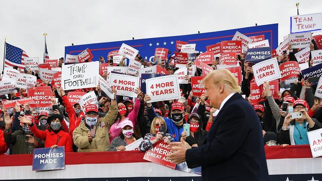 Supporters cheer as US President Donald Trump arrives to speak during a campaign rally at Pickaway Agriculture and Event Center in Circleville, Ohio on October 24.