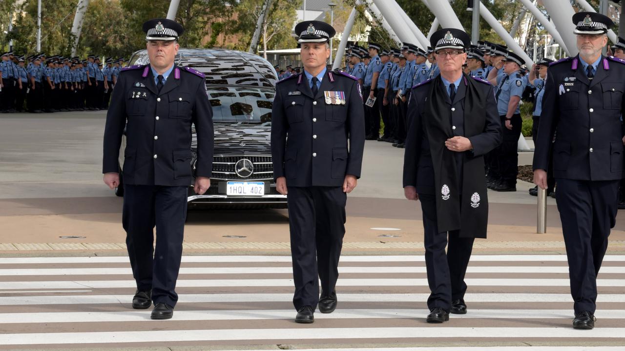 The hearse was followed by mounted police units and bagpipe players as it made its way around the stadium. Picture: NCA NewsWire / Sharon Smith