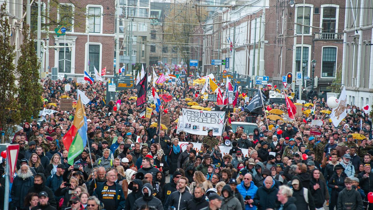 Protesters march through The Hague city centre, with flags, banners, horns and loudspeakers denouncing new government Covid-19 measures. Picture: Charles M. Vella/SOPA Images/LightRocket via Getty Images