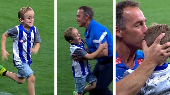 Ollie and Alastair Clarkson hug post-game.