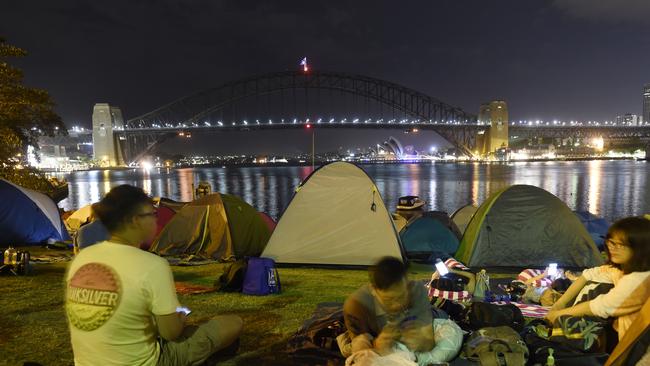 A photo of people camping out at McMahons Point a day before the fireworks in 2019.