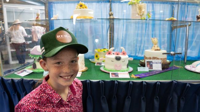 Macey Ritchie, 11, is a cake baking champion at the Gympie Show 2023. Two of her cakes took awards this year and are on display in the cake decoration cabinet. Picture: Christine Schindler