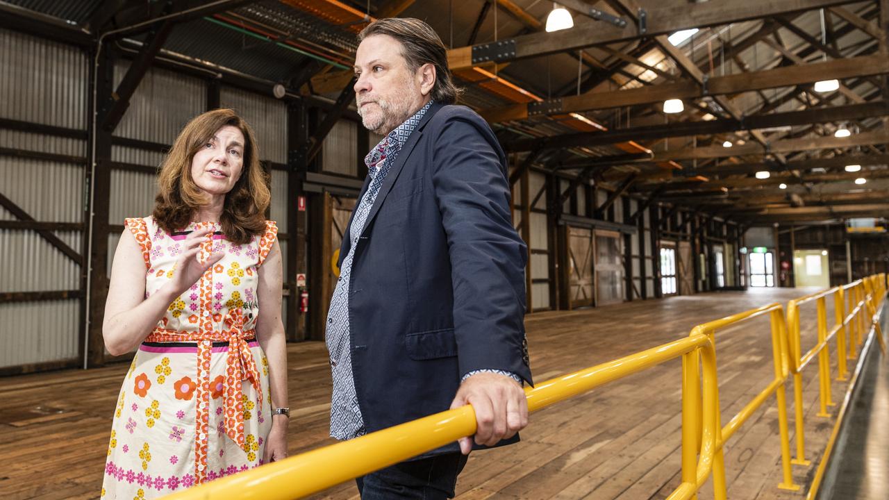 Independent candidate for Groom Suzie Holt shows music promoter and Powderfinger bassist John Collins inside The Goods Shed during a tour of potential live music venues. Picture: Kevin Farmer