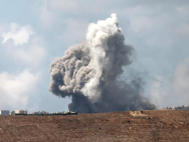 TOPSHOT - This picture taken from northern Israel along the border with southern Lebanon shows smoke billowing following Israeli bombardment, on September 23, 2024. Israel's military pounded Hezbollah targets in south and east Lebanon on September 23 and said more strikes were coming, warning Lebanese to stay out of harm's way despite international calls for restraint. (Photo by Jalaa MAREY / AFP)