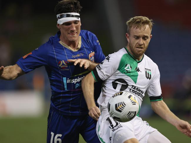 NEWCASTLE, AUSTRALIA - APRIL 05: Matthew Millar of the Jets contests the ball against Connor Pain of Western United during the A-League match between the Newcastle Jets and Western United FC at McDonald Jones Stadium, on April 05, 2021, in Newcastle, Australia. (Photo by Ashley Feder/Getty Images)