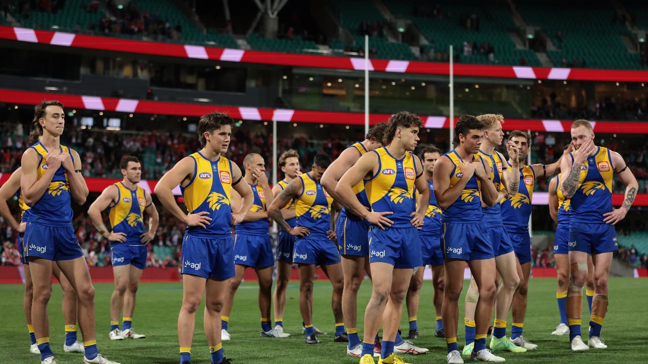 Eagles players look dejected. Photo by Mark Metcalfe/AFL Photos/via Getty Images.
