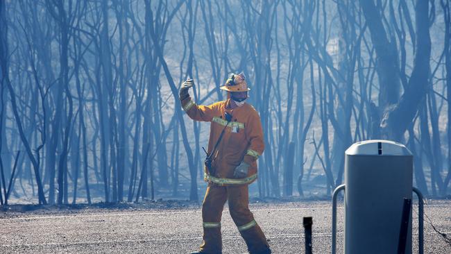 Firefighter working to control the North Rothbury blaze. Picture by Peter Lorimer.