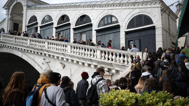 Tourists queue to climb Venice’s famous Rialto Bridge in April 2024. Picture: AFP