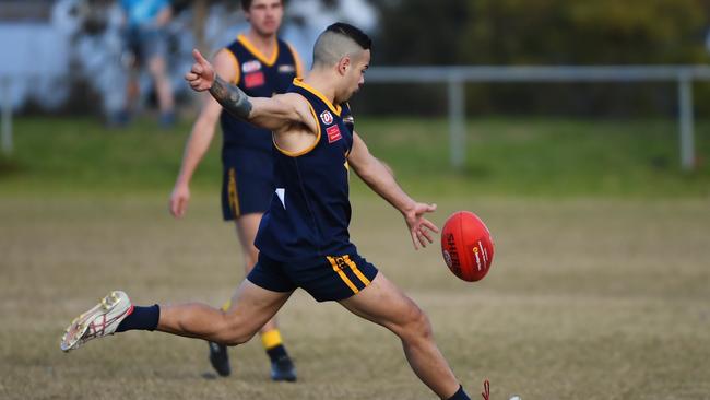 Marcus Claverisi launches a kick forward. Picture: James Ross.