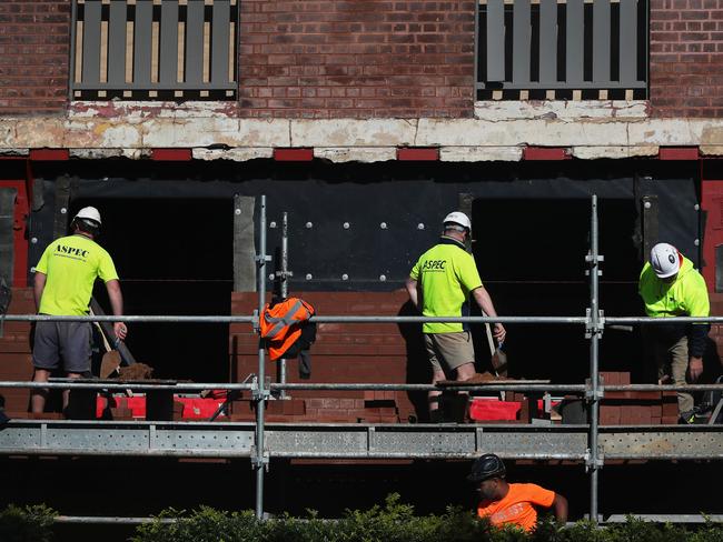 SYDNEY, AUSTRALIA - JUNE 24: Construction workers are seen onsite at a combined residential and commercial development in Surry Hills on June 24, 2024 in Sydney, Australia. Sydney's exorbitant housing costs have earned it the dubious distinction of being the second most expensive city in the world for housing, trailing only Hong Kong, in a recent international survey. With a median house price of $1.6 million as of late 2023, owning a home in Sydney is an unattainable dream for many residents and potential buyers. (Photo by Lisa Maree Williams/Getty Images)