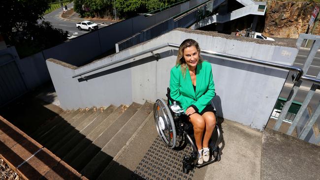 Karni Liddell highlights the obstacles at Kangaroo Point for people in wheelchairs, with limited mobility or who are travelling with prams. Picture: David Clark