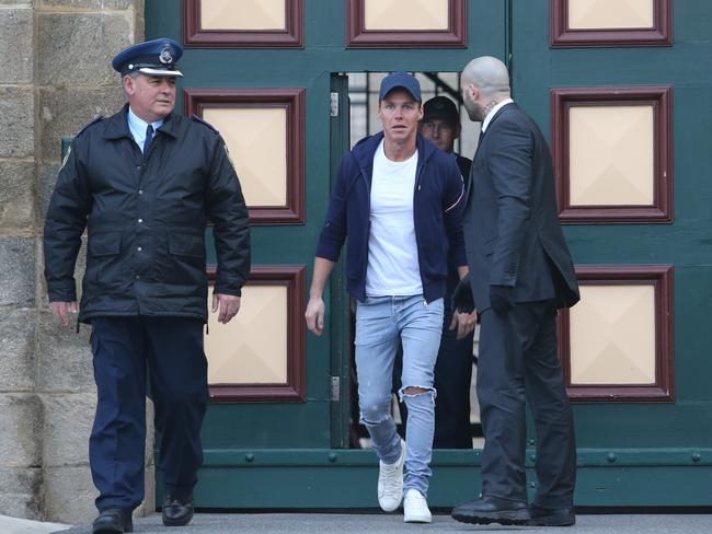 Oliver Curtis emerges free from prison into a chilly morning outside Cooma Correctional Centre and into the hands of his driver.