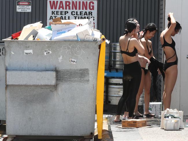 Surfers Paradise not putting its best foot forward. Some of the poor sights around town. Showering next to bins and kegs behind the Surfers SLSC in Hanlan St.,..  Picture Glenn Hampson