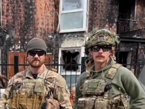 Felix Metrikas, right, with members of the Ukrainian National Guard at Hostomel in the country's north.