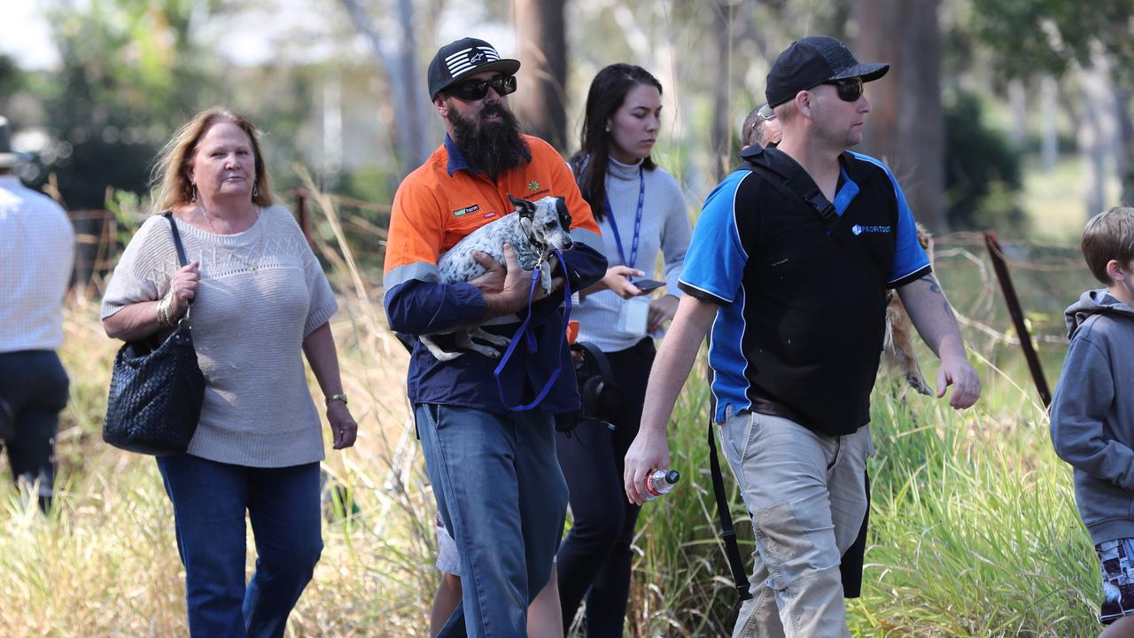 Residents leave with their pets. Picture: Peter Wallis