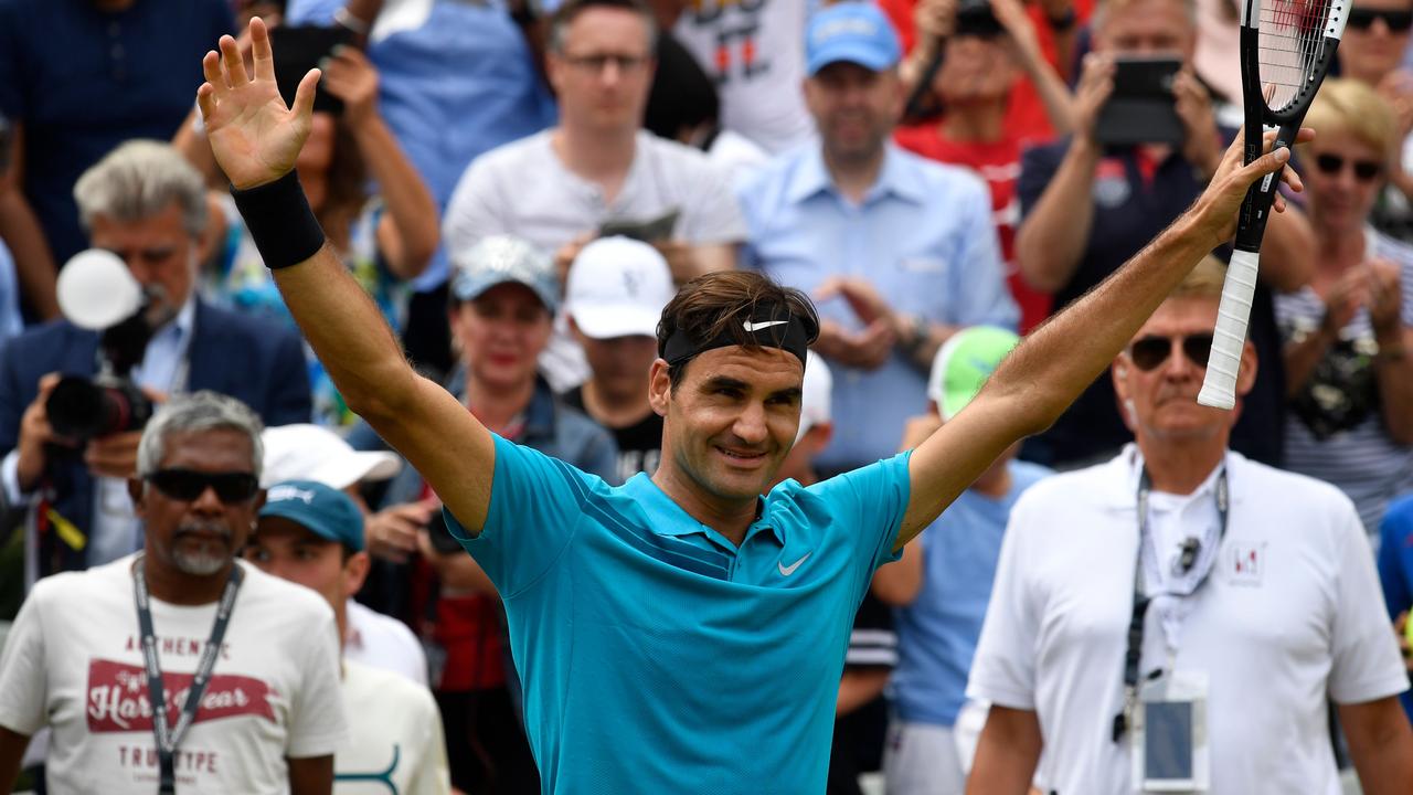 Switzerland's Roger Federer celebrates winning the ATP Mercedes Cup tennis tournament in Stuttgart.