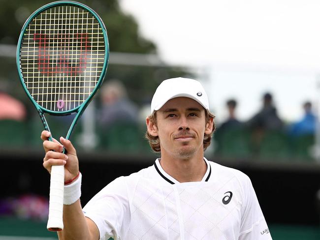 Australia's Alex De Minaur celebrates winning against Australia's James Duckworth during their men's singles tennis match on the second day of the 2024 Wimbledon Championships at The All England Lawn Tennis and Croquet Club in Wimbledon, southwest London, on July 2, 2024. De Minaur won the match 7-6, 7-6, 7-6. (Photo by HENRY NICHOLLS / AFP) / RESTRICTED TO EDITORIAL USE