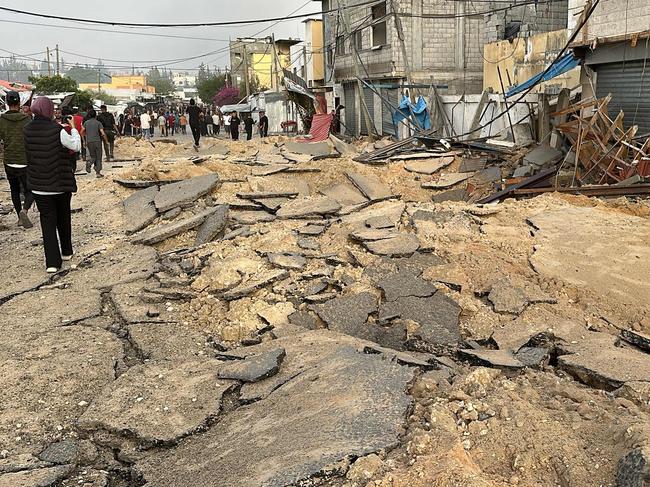 People check the destruction following an Israeli strike in Khan Yunis in the southern Gaza Strip. Picture: AFP