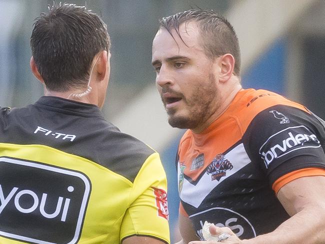 Josh Reynolds of the Tigers questions Michael Chee Kam of the Tigers being sent to the sin bin during the Round 14 NRL match between the Cronulla-Sutherland Sharks and the Wests Tigers at Southern Cross Group Stadium in Sydney, Sunday, June 10, 2018. (AAP Image/Craig Golding) NO ARCHIVING, EDITORIAL USE ONLY