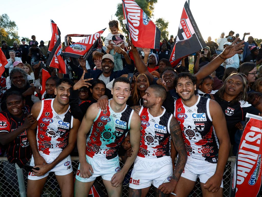 Nasiah Wanganeen-Milera, Marcus Windhager, Bradley Hill and Isaac Keeler celebrate after the win. Picture: Michael Willson/AFL Photos