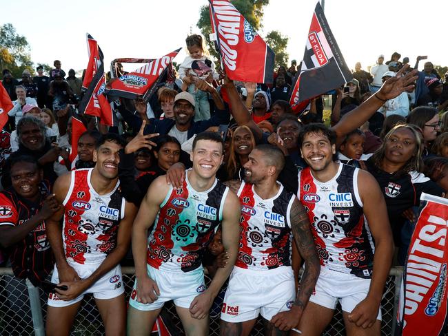 Nasiah Wanganeen-Milera, Marcus Windhager, Bradley Hill and Isaac Keeler celebrate after the win. Picture: Michael Willson/AFL Photos