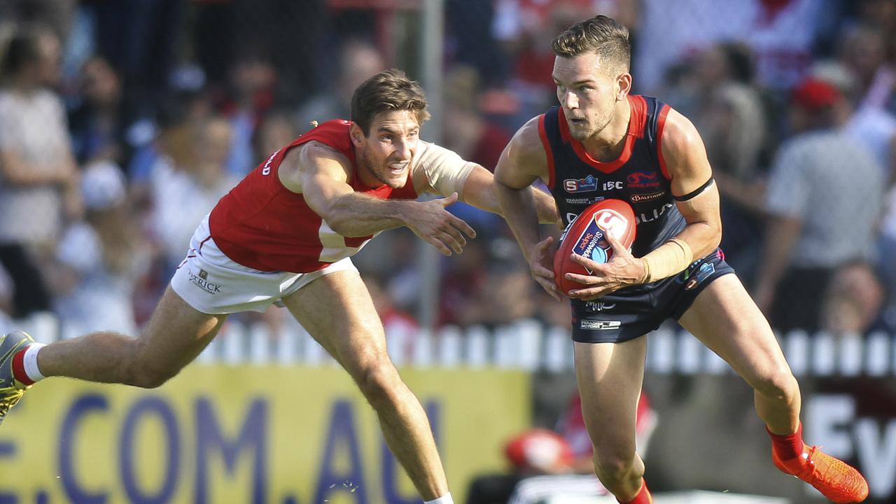 SANFL: North Adelaide v Norwood at Prospect Oval. Norwood's Matthew Nunn evades North's Aidan Tropiano. 25 April 2019. Picture Dean Martin