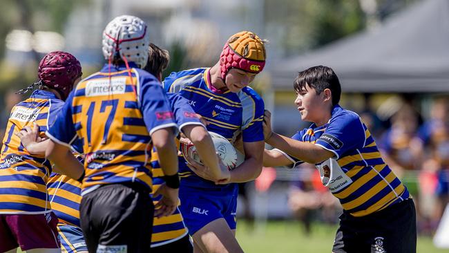 Day One of King of the Country rugby tournament at James Overell Park, Southport. possible. Sunshine Coast Invitational Barbarians U13s (Blue/yellow) v USQ Saints U13s (being tackled). Picture: Jerad Williams