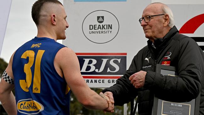 Noble Park’s Blake O'Leary collected the best-on-ground honours. Pictured with EFNL chairman Graham Halbish. Picture: Andy Brownbill