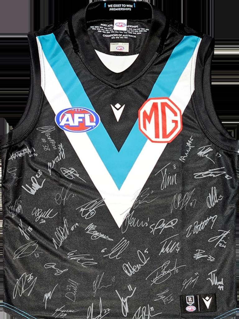 Signed Port Adelaide guernsey and a scarf will be prizes of The Advertiser's Best Port Adelaide tattoo competition.