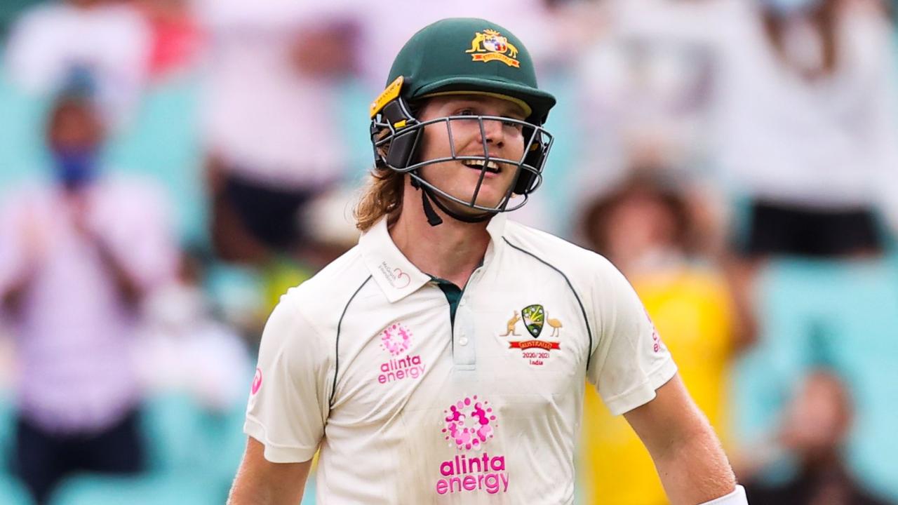 Australia's Will Pucovski celebrates after scoring a half-century.