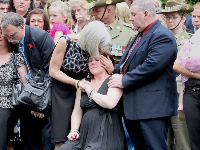 NEWS: bcm.10.9.10 Funeral of LCPL Jared MacKinney at Ashgrove Baptist Church. Wife Beckie sitting and daughter Annabell in pink being cuddled. Prime Minister Julia Gillard and Opp Leader Tony Abbott attended, Jared was the 21st Australian soldier to die in Afghanistan.